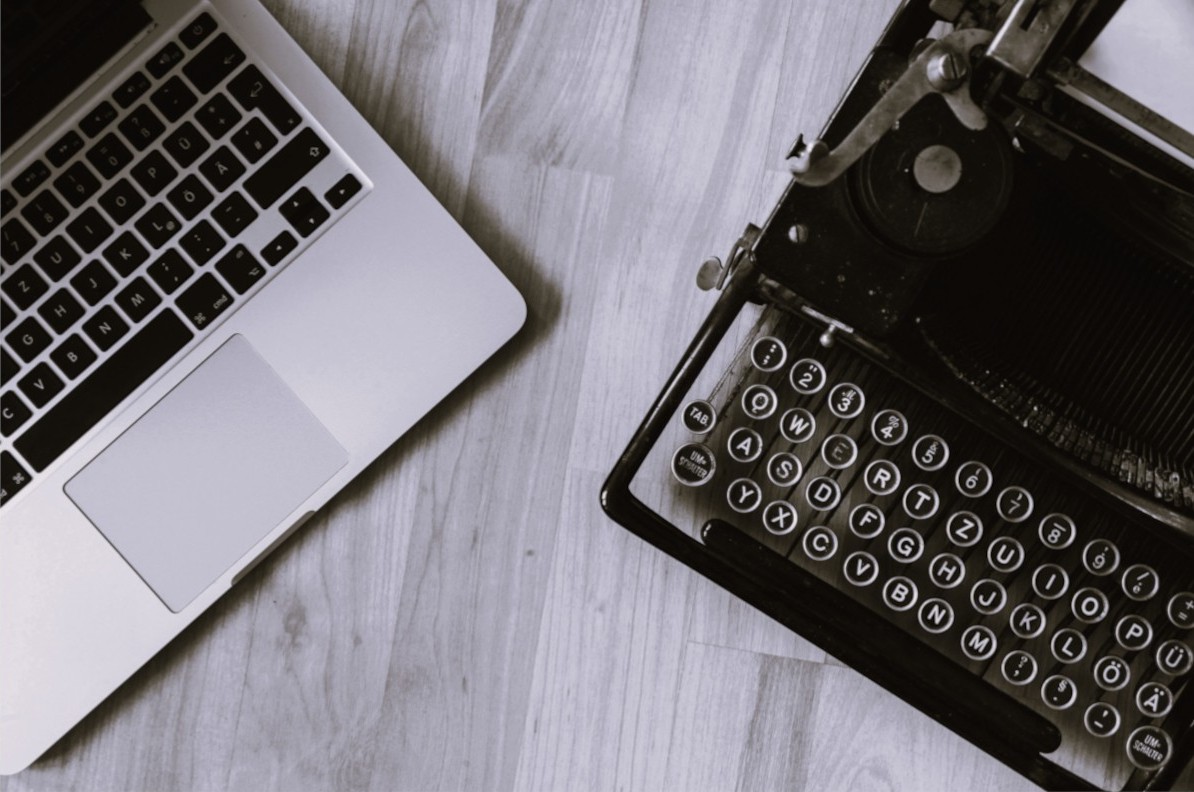 Laptop keyboard on the left, typewriter on the right